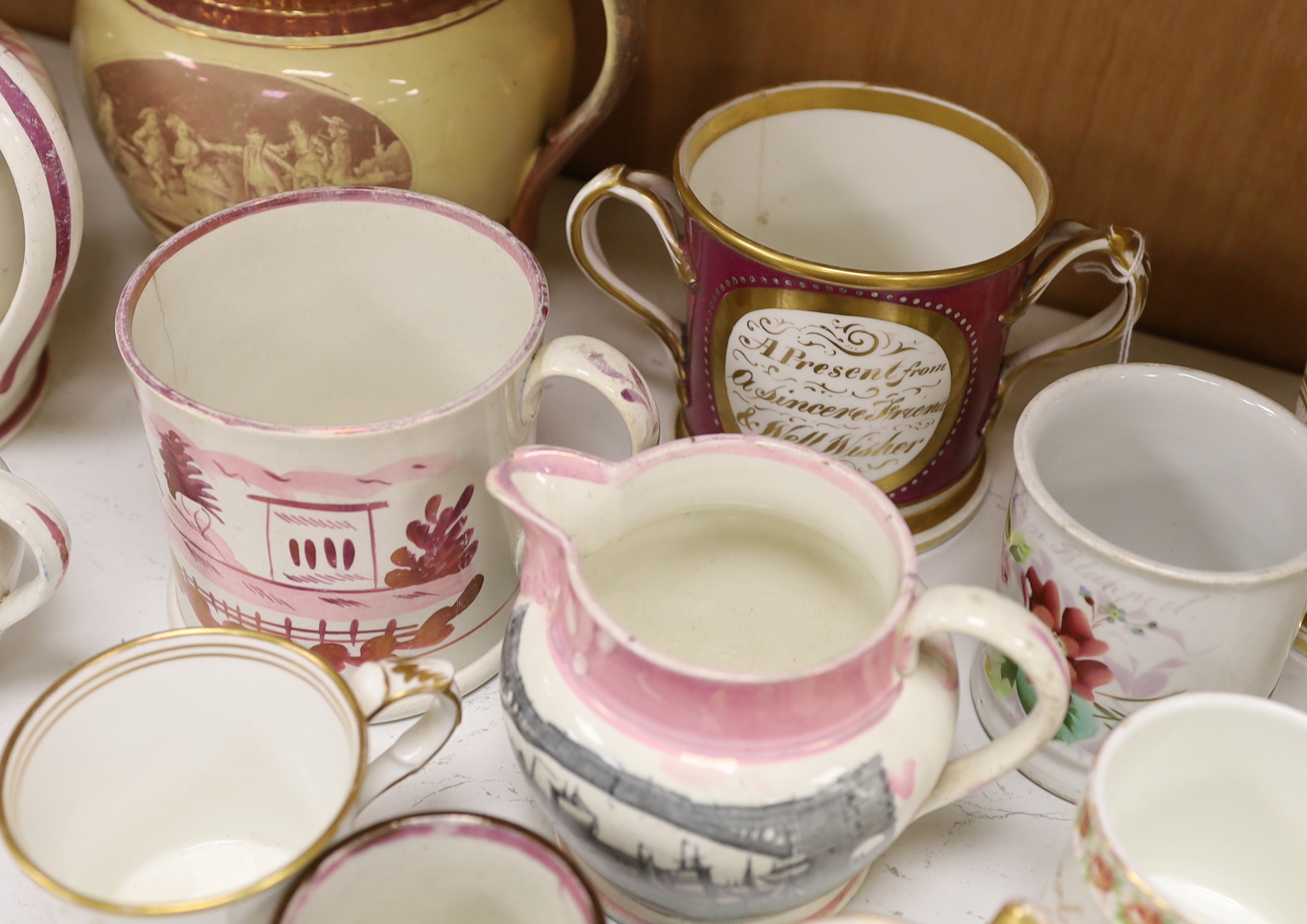 A group of 19th century Staffordshire christening mugs and pink lustre wares